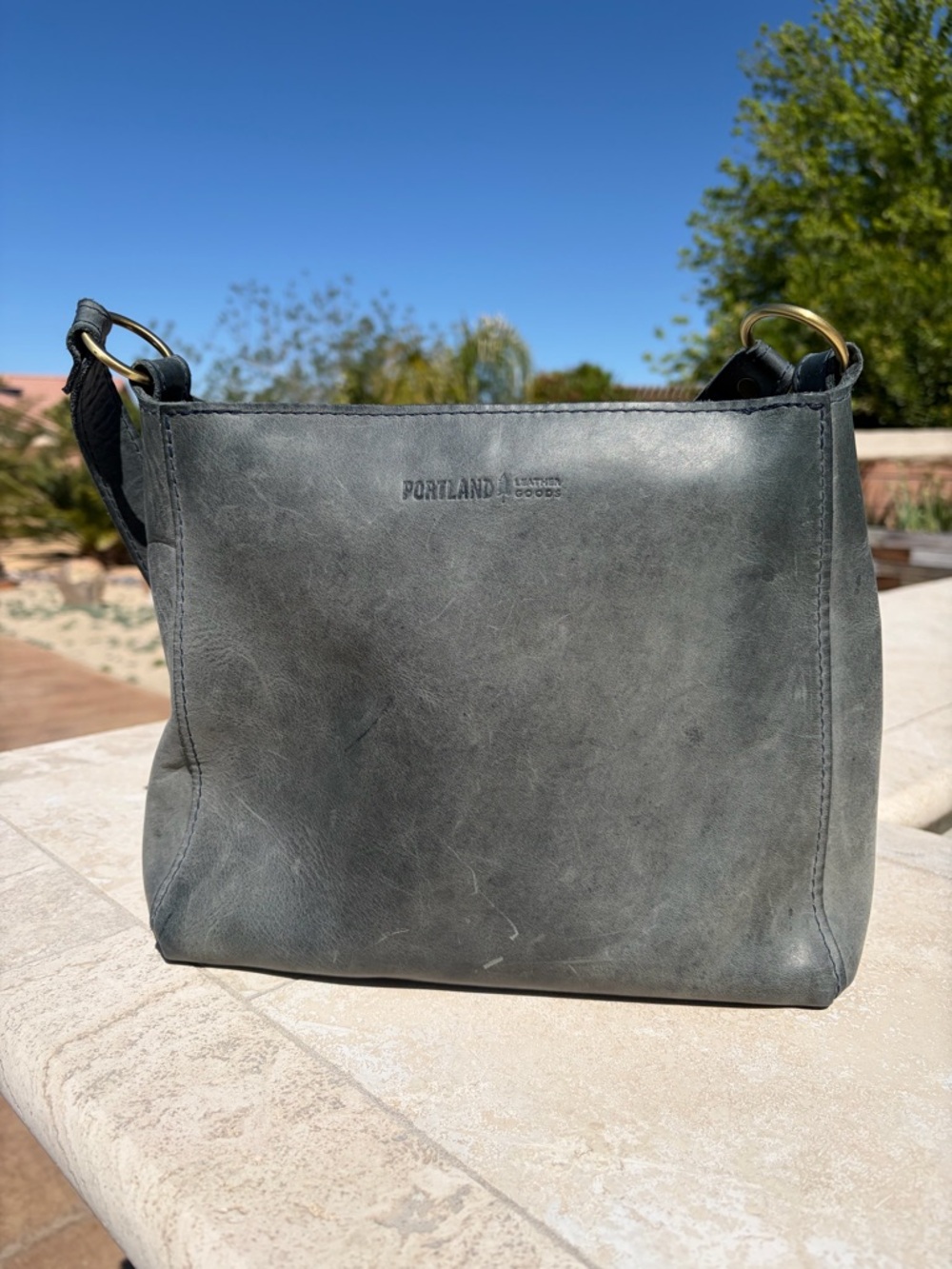 Portland Leather Triangle Shoulder bag in color Storm